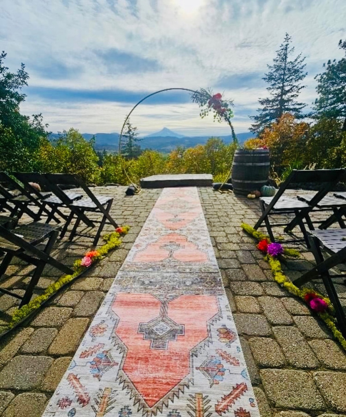 Romantic outdoor wedding ceremony site with arch and seating