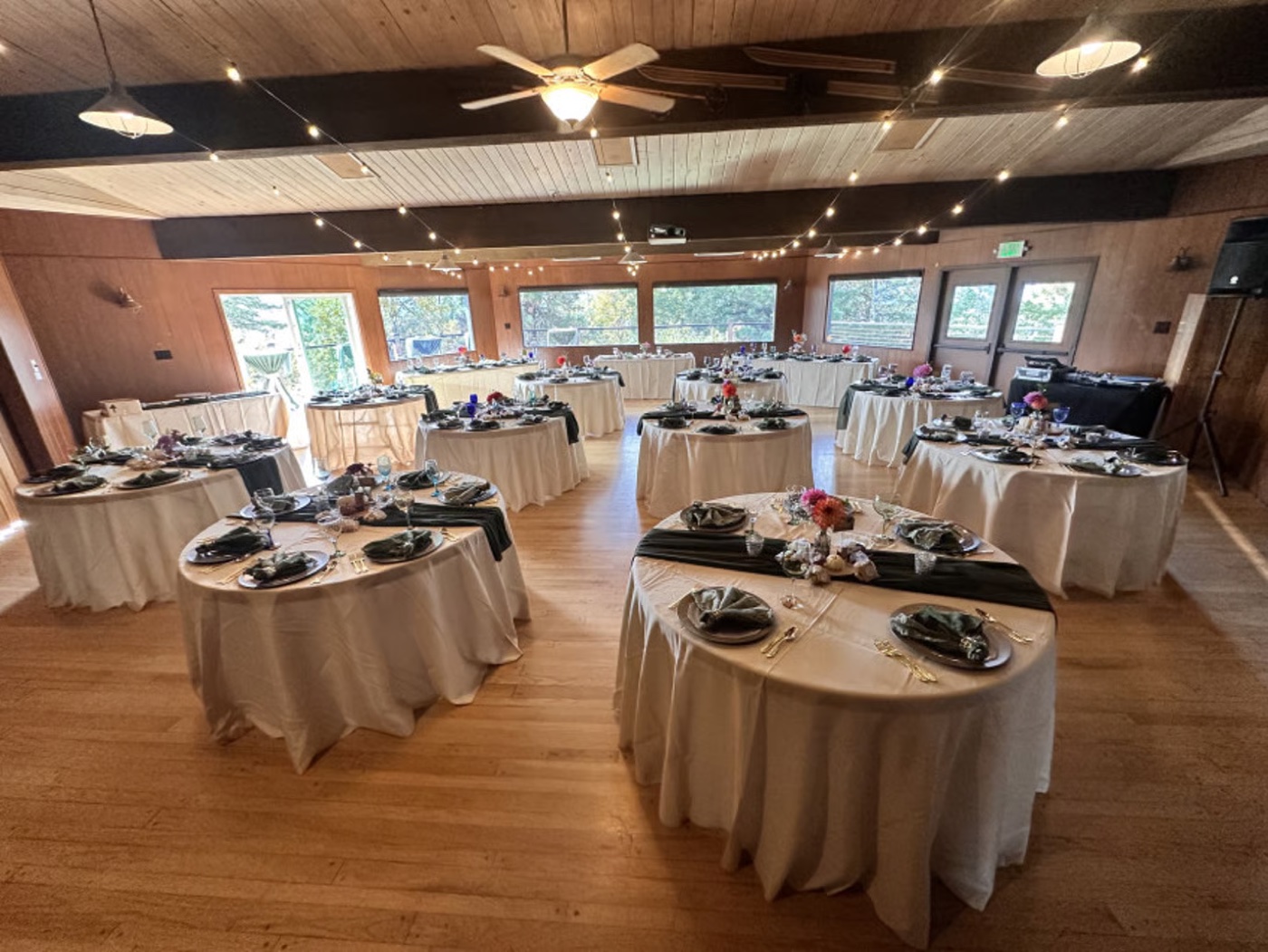 Beautifully designed outdoor wedding reception site with tables and ambiance